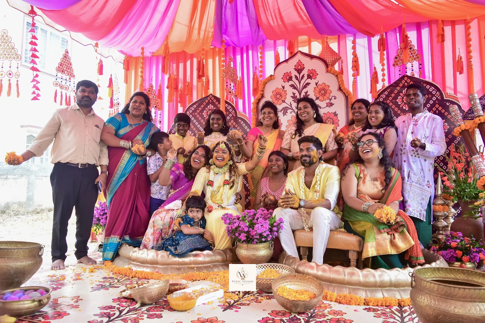 A large family gathering for a colourful traditional celebration