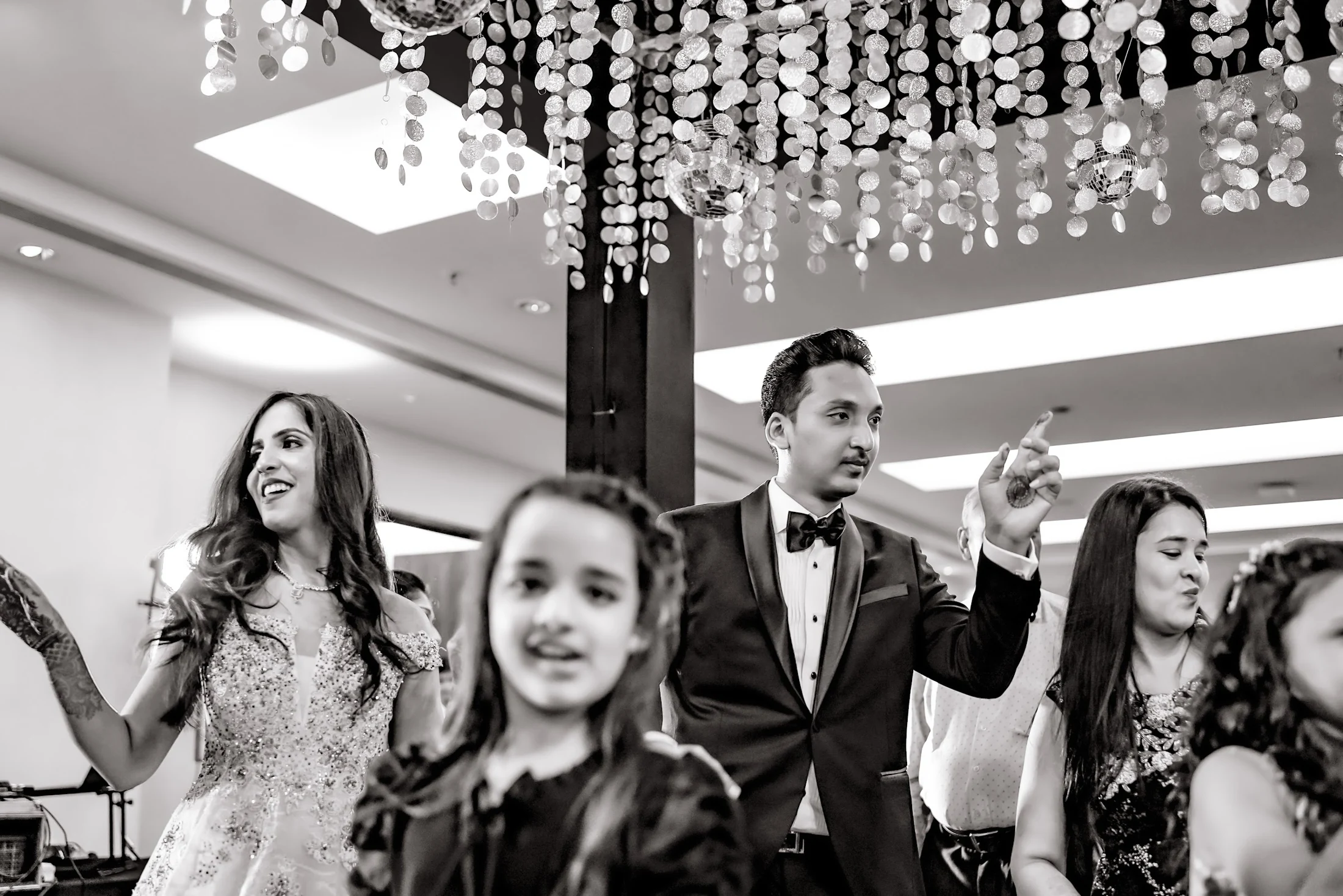 Family and guests sharing a joyful dance-floor moment