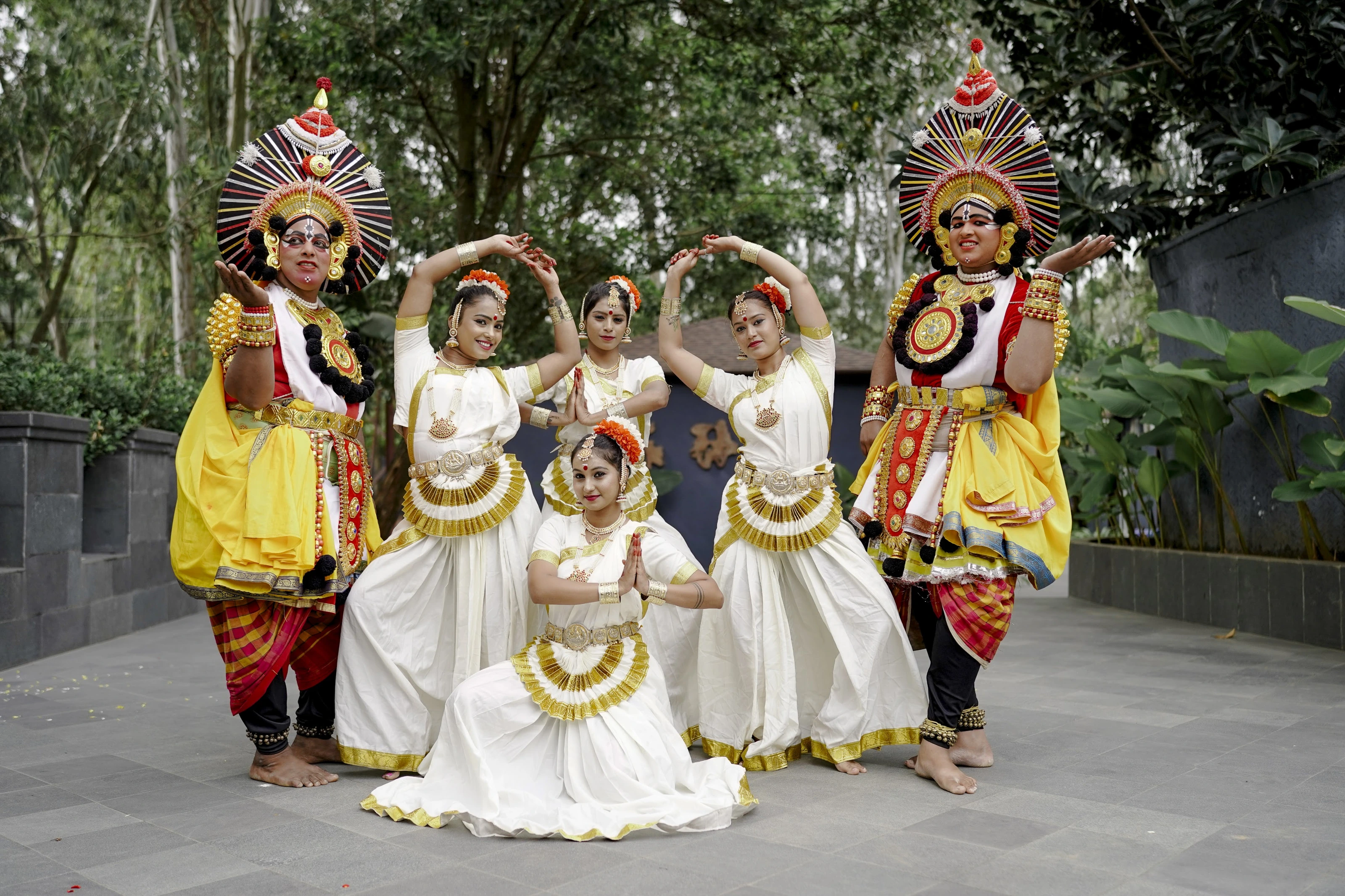 A group of traditional performers in colourful ceremonial costumes