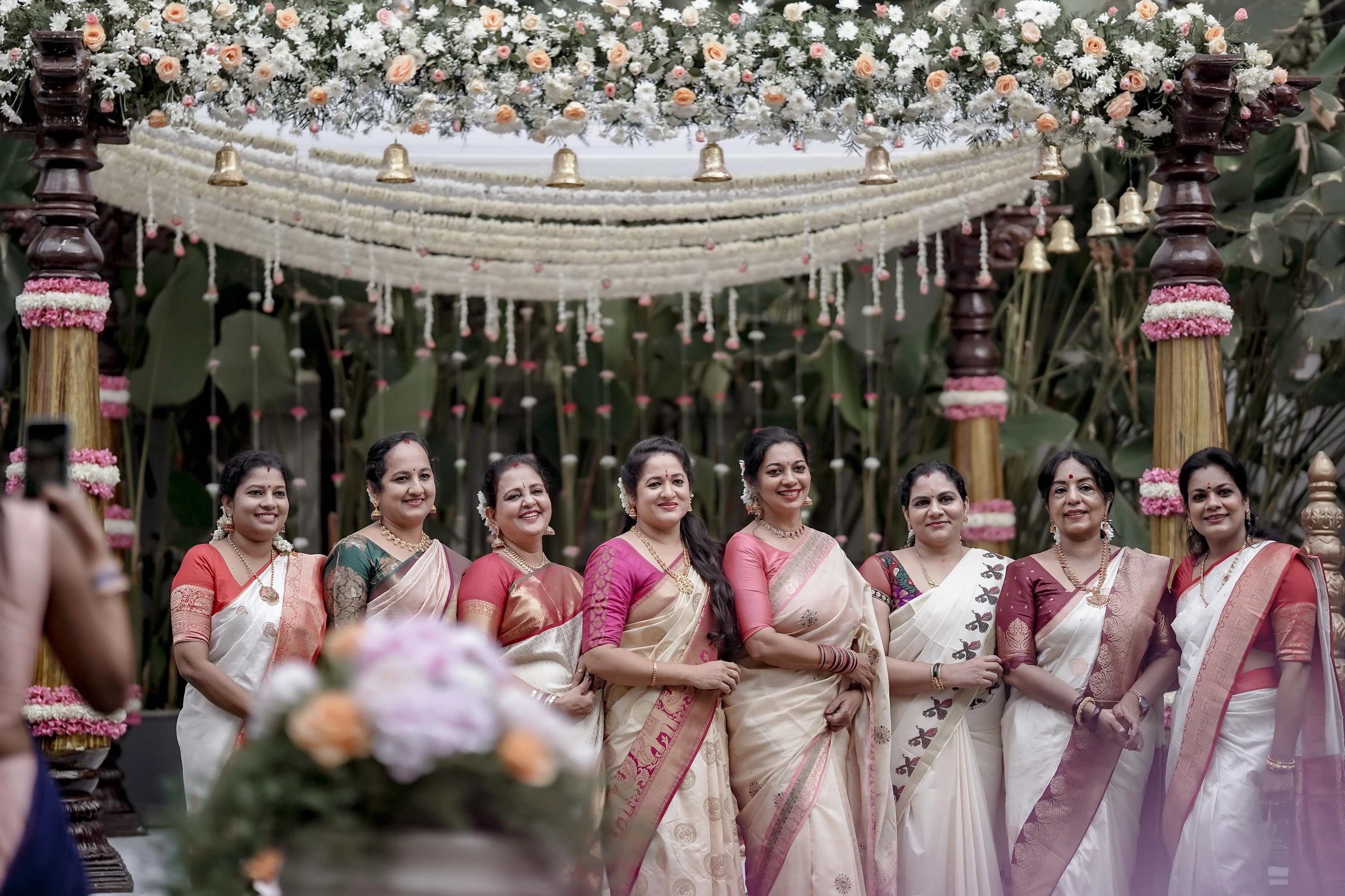 Family and friends gathered at a garden wedding ceremony